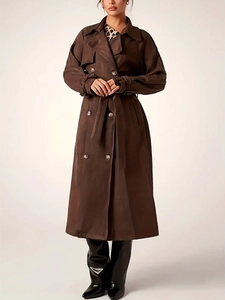 Classic dark brown double-breasted long trench coat with waist belt and lapel collar