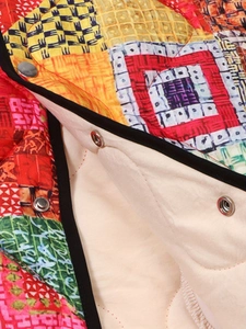 Women's quilted cotton coat with colorful abstract patterns and metal snap buttons