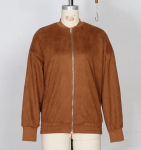 Detail of caramel faux suede bomber jacket with metal zipper and ribbed cuffs