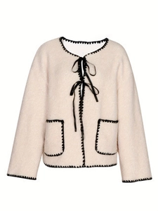Elegant cream sherpa jacket with contrast black lace trim and bow tie closures