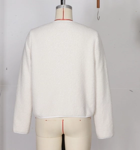 Detail view of white lamb wool texture and back stitching on this stylish fleece jacket