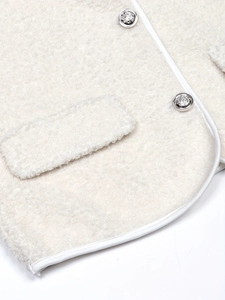 Women's off-white faux shearling jacket with silver metal buttons and leather piping trim