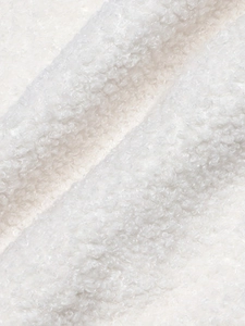 Cozy white sherpa fleece fabric detail on a stylish women's long sleeve winter jacket