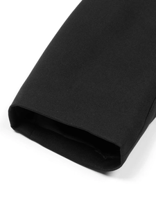 Close-up of the smooth black woven fabric and neat cuff stitching on this cropped blazer