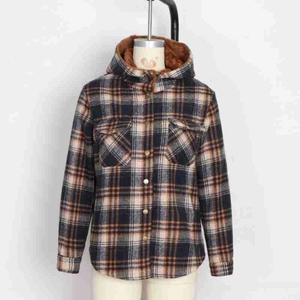 Detail of warm brown plush lining and plaid flannel fabric on a hooded winter jacket