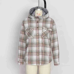 Detail of hooded plaid jacket showing thick plush lining and flap chest pocket detail
