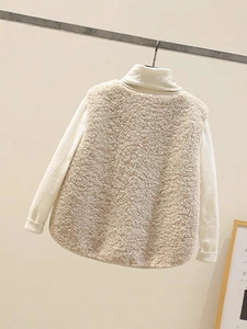 Women's beige faux shearling vest with cozy lamb wool texture and rounded hem design