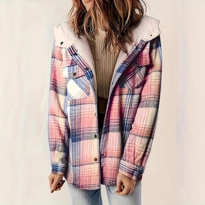 Detail of blue and pink plaid jacket with warm white fleece lining and front buttons