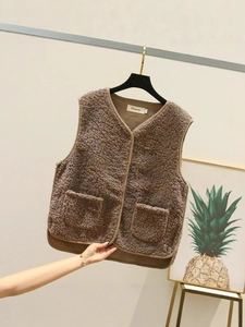 Short brown sherpa fleece vest with V-neck, button closure and two front pockets