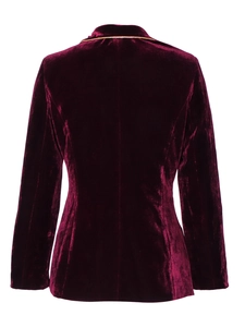 Détail de la veste en velours cintrée vue de dos avec passepoil doré et coupe ajustée