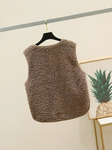 Short brown lamb wool fleece vest for women featuring warm curly texture and sleeveless cut