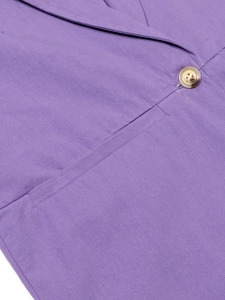Close-up of purple linen blazer detailing resin button and welt pocket texture