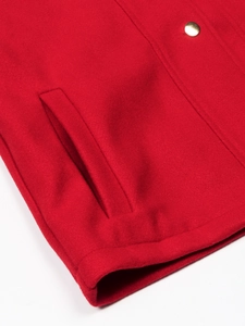 Red wool blend jacket with golden button and detailed side pocket stitching craftsmanship