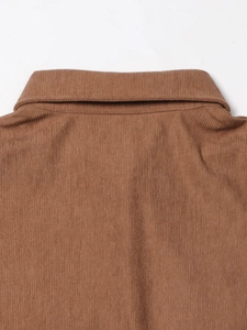 Detail of brown corduroy fabric texture and stitching on the collar and back of the jacket