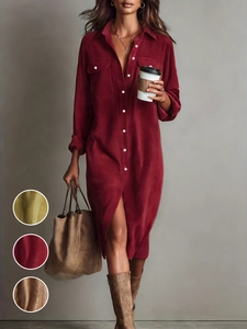 Close-up of ribbed corduroy fabric texture and buttons on a burgundy shirt dress