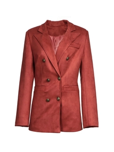 Detailed close-up of brick red suede blazer with vintage buttons and satin lining