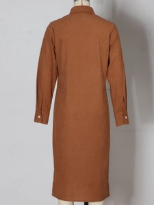 Back view of a tan long-sleeve corduroy shirt dress with a classic collar and white buttons