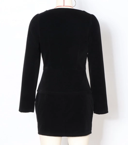 Rear view of elegant two-piece women's set with slim-fit blazer and fitted mini skirt