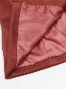 Detail view of premium rust red faux suede jacket with smooth satin lining and clean stitching