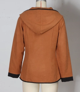 Detail of burnt orange hooded jacket with black contrast trim and slim fit back seams