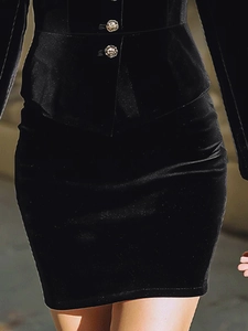 Elegant black velvet two-piece set featuring golden buttons and fitted mini skirt