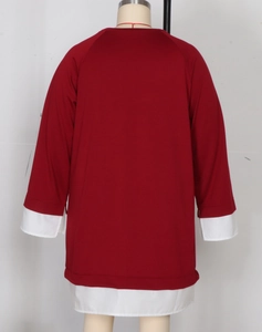 Back view of a plus-size casual red and white spliced long-sleeve knit top with rib cuffs