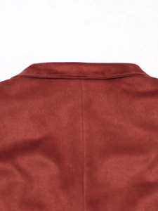 Detailed close-up showing stitching and suede texture on back of brick red blazer