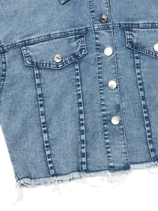 Women's wash blue denim jacket with front metal buttons and a stylish raw hem finish
