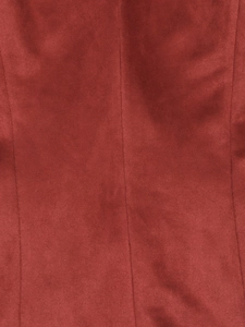 Detailed close-up of red suede fabric texture and vertical stitching on retro jacket