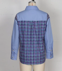 Detail view of contrast patchwork back design and classic plaid pattern on long sleeve shirt