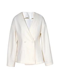 Detail view of beige cropped blazer with double-breasted buttons and textured fabric