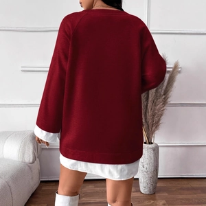Women's burgundy loose sweatshirt layered over long white shirt with sleek white boots