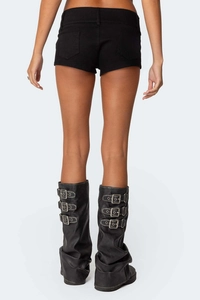 Rear view of black denim shorts with punk style buckled leather boot gaiters