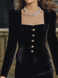 Elegant black velvet two-piece set featuring a square neck top with gold buttons and skirt