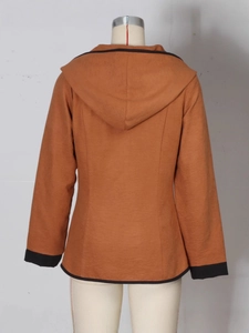 Back view of a camel hooded jacket with black contrast trim and structured seams