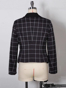 Back view of slim fit black and white houndstooth blazer with sharp tailored shoulders