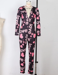Detail of slim-fit dark onesie with pink heart and love prints and button V-neckline