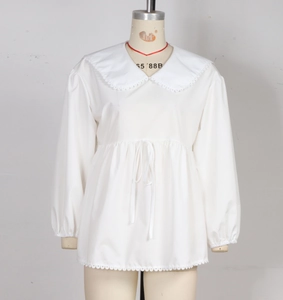 Detail view of white blouse featuring Peter Pan collar with delicate lace trim and drawstring waist