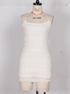 White ruched halter neck bodycon mini dress with textured fabric shown on a mannequin