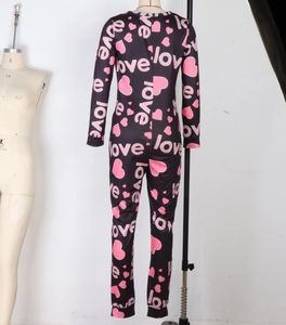 Detail of black slim-fit onesie with pink heart and love print on soft jersey fabric