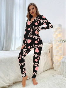 Women's V-neck long sleeve jumpsuit with pink love heart print on black knit fabric