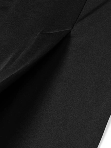 Close-up of premium black fabric texture with fine stitching and slim waist cut details