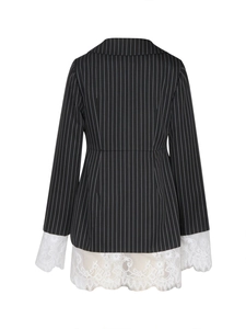 Detail view of black striped blazer back featuring delicate white lace patchwork hem