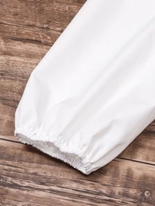 Detail shot of white blouse elastic cuffs with delicate pleated lantern sleeve texture