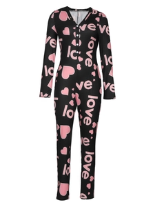 Close-up of heart and love letter prints on black long sleeve buttoned romper pajama