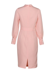 Detail view of pink midi dress showing the back zip, sleeve buttons, and rear hem slit