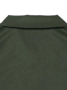 Detail of the stitching and fabric texture on a dark green collared dress shirt