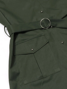 Detail of dark green dress showing utility pocket, metal buttons and round buckle belt