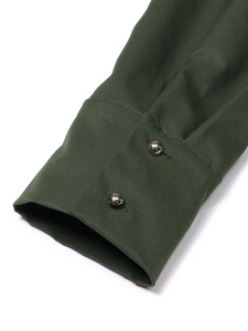 Close-up of dark green dress cuffs with textured twill fabric and silver metal buttons