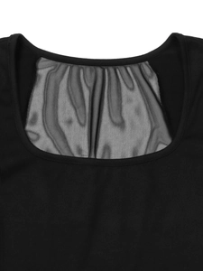 Detailed view of the black square neckline with delicate sheer mesh patchwork details